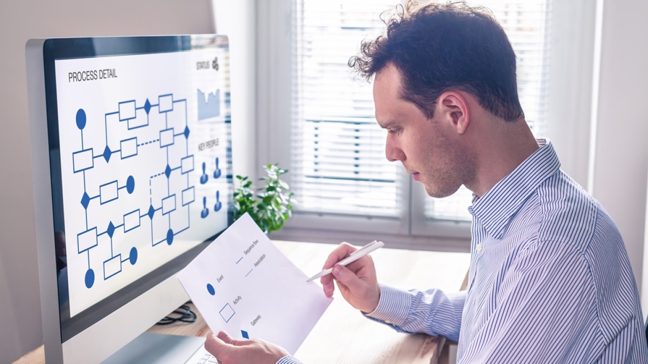 Businessman or engineer working on business process automation or algorithm